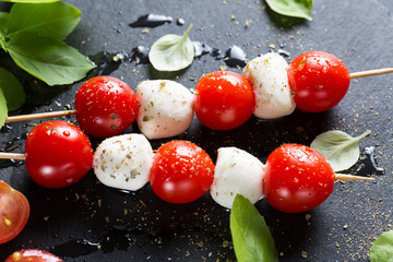 Mozzarella and cherry tomatoes on skewers