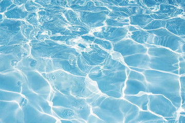 Texture of water in swimming pool for background