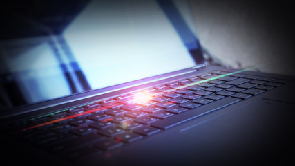 Laptop, keyboard close-up, neon light 