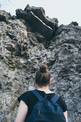 Naklejka na ściany i meble Girl near a rock