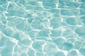 Texture of water in swimming pool for background