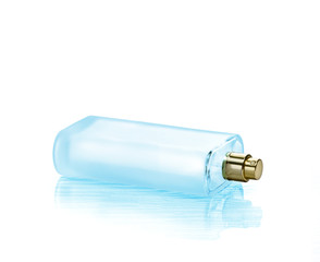 Empty perfume spray bottle with blue reflection