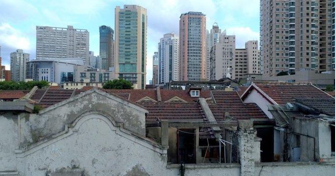 One of the very few remaining old Shanghai style residential areas shortly before its demolition, to make way for more high-rise development, such as those seen in the background.