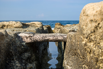 A path in the rock near the sea.