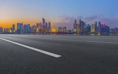 Fototapeta premium Urban road asphalt pavement and skyline of Hangzhou architectural landscape