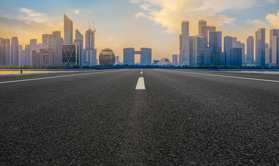 Urban road asphalt pavement and skyline of Hangzhou architectural landscape