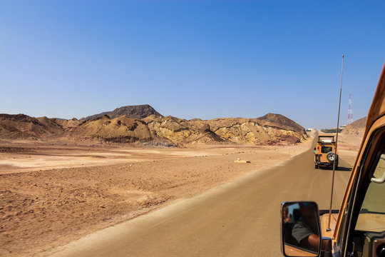 Abu Dhabi, UAE - March, 2018: Island Sir Bani Yas Jeep safari.  Mountain landscape with off-road vehicle. UAE.