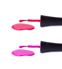 A brush from nail polish and a spilled varnish of purple on a white background