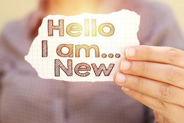  business woman holding tear paper with hello i am new text © hadjanebia