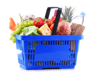 Plastic shopping basket with assorted grocery products