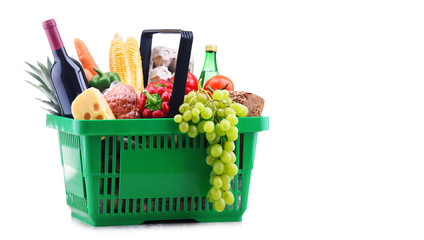 Plastic shopping basket with assorted grocery products