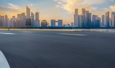 Urban road asphalt pavement and skyline of Hangzhou architectural landscape