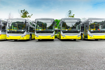 New electric bus parked in open-air parking lot