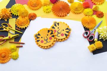 Children's DIY paper tiger. The child's hands
