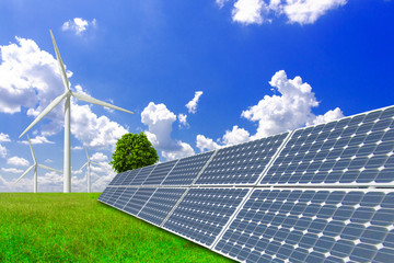 Wind turbines and solar panels on vast grasslands