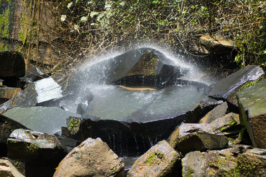 water fall on black stone