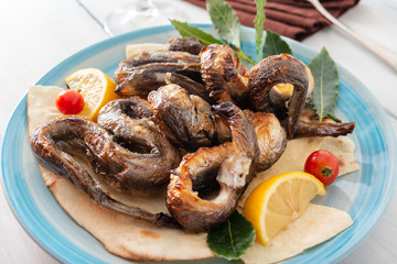 Anguille arrosto, tipico cibo sardo,  roasted eels, Sardinian food