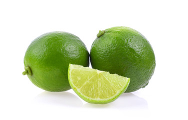 whole and slice fresh green lime isolated on white background