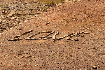 An inscription lined with stone on the shore of the lake
