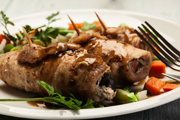 Pork rolls and vegetables