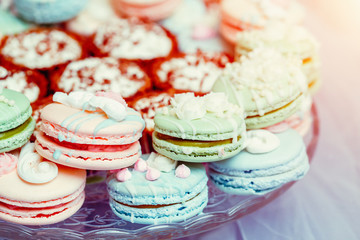 Obraz na płótnie Canvas Wedding candy bar. Dessert table with a macaroons
