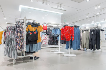 Various shop clothing in ladies' clothing store in summer