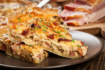 Pieces of quiche lorraine with bacon and cheese
