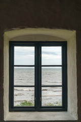 Old window with view over sea