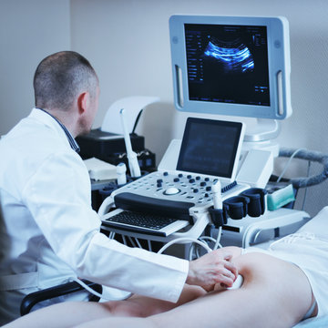 Doctor doing ultrasound scan. Pelvic ultrasound