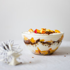 trifle with granola and nectarine. Healthy breakfast