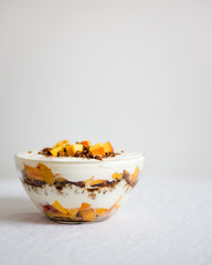 trifle with granola and nectarine. Healthy breakfast