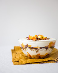 trifle with granola and nectarine. Healthy breakfast