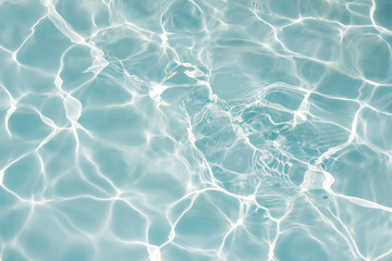 Texture of water in swimming pool for background