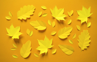 Autumn leaves made from paper orange background