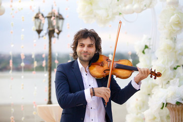 The musician is a violinist with his violin instrument © Fotoproff