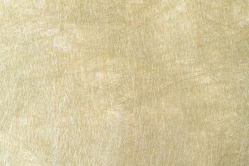 Shiny hot yellow gold foil golden color glitter decorative texture paper: Bright brilliant festive metallic textured empty wallpaper backdrop: Tin metal material for holiday craft design decoration