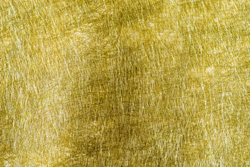 Shiny hot yellow gold foil golden color glitter decorative texture paper: Bright brilliant festive metallic textured empty wallpaper backdrop: Tin metal material for holiday craft design decoration