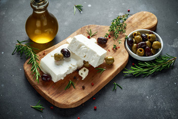 Greek cheese feta with thyme, rosemary and olives - obrazy, fototapety, plakaty