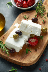 Greek cheese feta with thyme, rosemary, olives and stuffed red bell peppers
