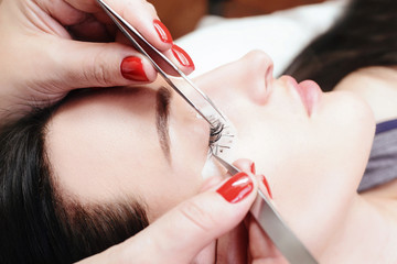 Eyelash Extension Procedure. Woman Eye with Long Eyelashes. Lashes, close up, macro, selective focus