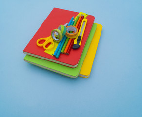 School supplies on blue background. Back to school