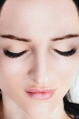 Fototapeta premium Eyelash Extension Procedure. Woman Eye with Long Eyelashes. Lashes, close up, macro, selective focus