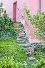 Stone steps of ancient house in historic medieval village