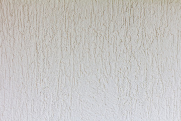 texture of rough light stucco on the wall