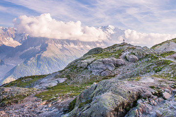 Outdoor Photographer Standing on the Edge of Mountain in front of Iconic Mont-Blanc