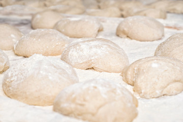 Fototapeta na wymiar Raw fresh dough in industrial bakery