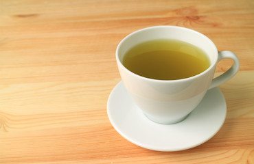 Hot Japanese Green Tea Served on Natural Color Wooden Table 