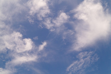 Blue sky with clouds background.