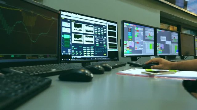 Slow motion: Male Asian engineers are operating in a regulated electricity system