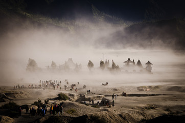 Sandstorm passing through a monastery in the Sea of Sand of Mount Bromo calderra, Java, Indonesia
